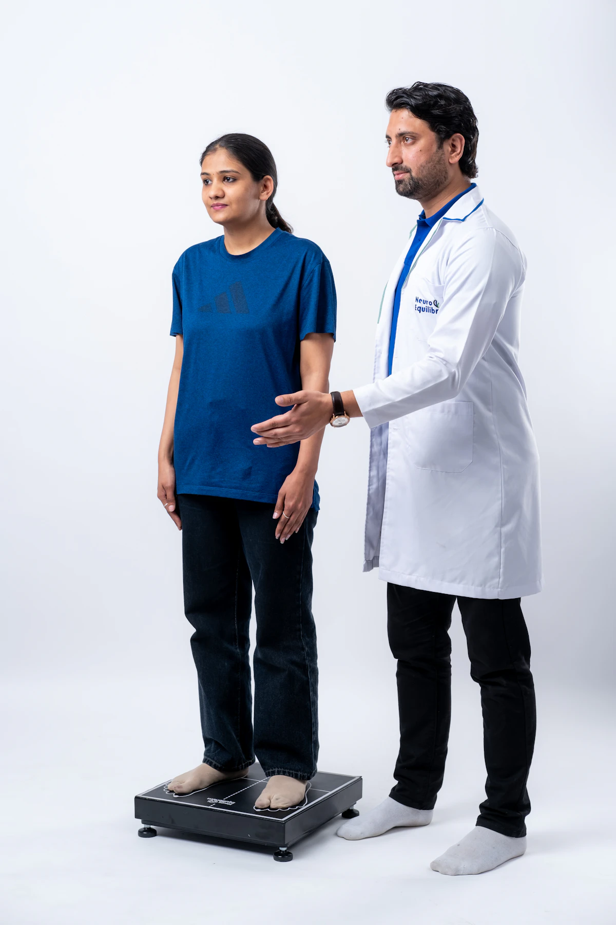 Medical professional guiding an athlete through a physical assessment